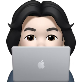 Amos Memoji behind laptop